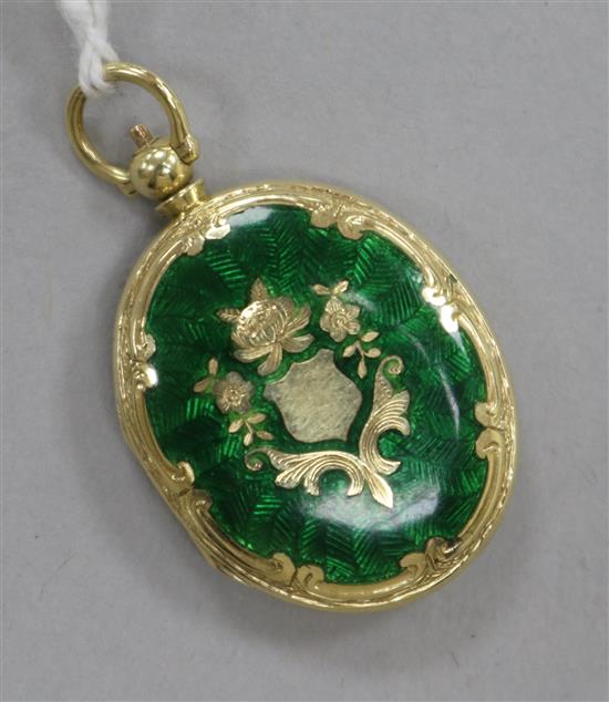 A 15ct gold and green enamel oval locket pendant, 30mm.